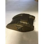 A solid bronze WW1 tank 8cms long and weighing in excess of 600 grams.
