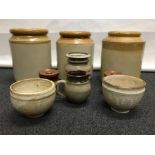 An assortment of saltglazed pots and jugs of varying forms.