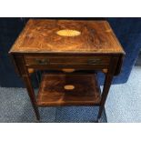 An Edwardian hard wood drop leaf occasional table with single drawwer and undertier shelf.
