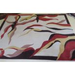 Tapis contemporain en laine. Porte une signature. -