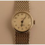 Elitam. Montre de dame et son bracelet en or gris. PB. 42g. -