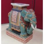 Sellette en céramique figurant un éléphant. Haut : 57 cm. -