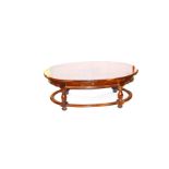 A Large Oval Mahogany Coffee Table