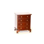 A Small Shaped Front Chest of Four Drawers