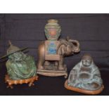 An Ornamental Elephant and Two Unusual Buddha Figurines