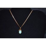 A Large 14ct Gold Opal Pendant on a 14ct Gold Chain