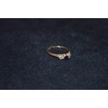 A 9ct Gold Sapphire and Diamond Three Stone Ring