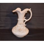 A Second Period Belleek Flower Encrusted jug