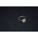 A 9ct Gold Blue Topaz and Diamond Cluster Ring