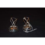 A Pair of Silver 'Hockey Stick' Place Card Holders