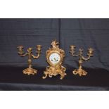 A Very Nice Three Piece Gilted Metal Clock Set