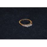 An 18ct Gold and Platinum Diamond Three Stone Ring