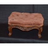 An Upholstered Button Top Footstool