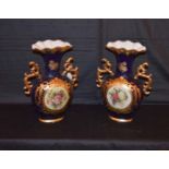 A Very Nice Pair of Gilted and Decorated Vases