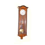 A Slimline Walnut Cased Single Weight Vienna Wall Clock