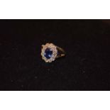 A Platinum Set Sapphire (2.2ct) and Diamond (0.85ct) Cluster Ring
