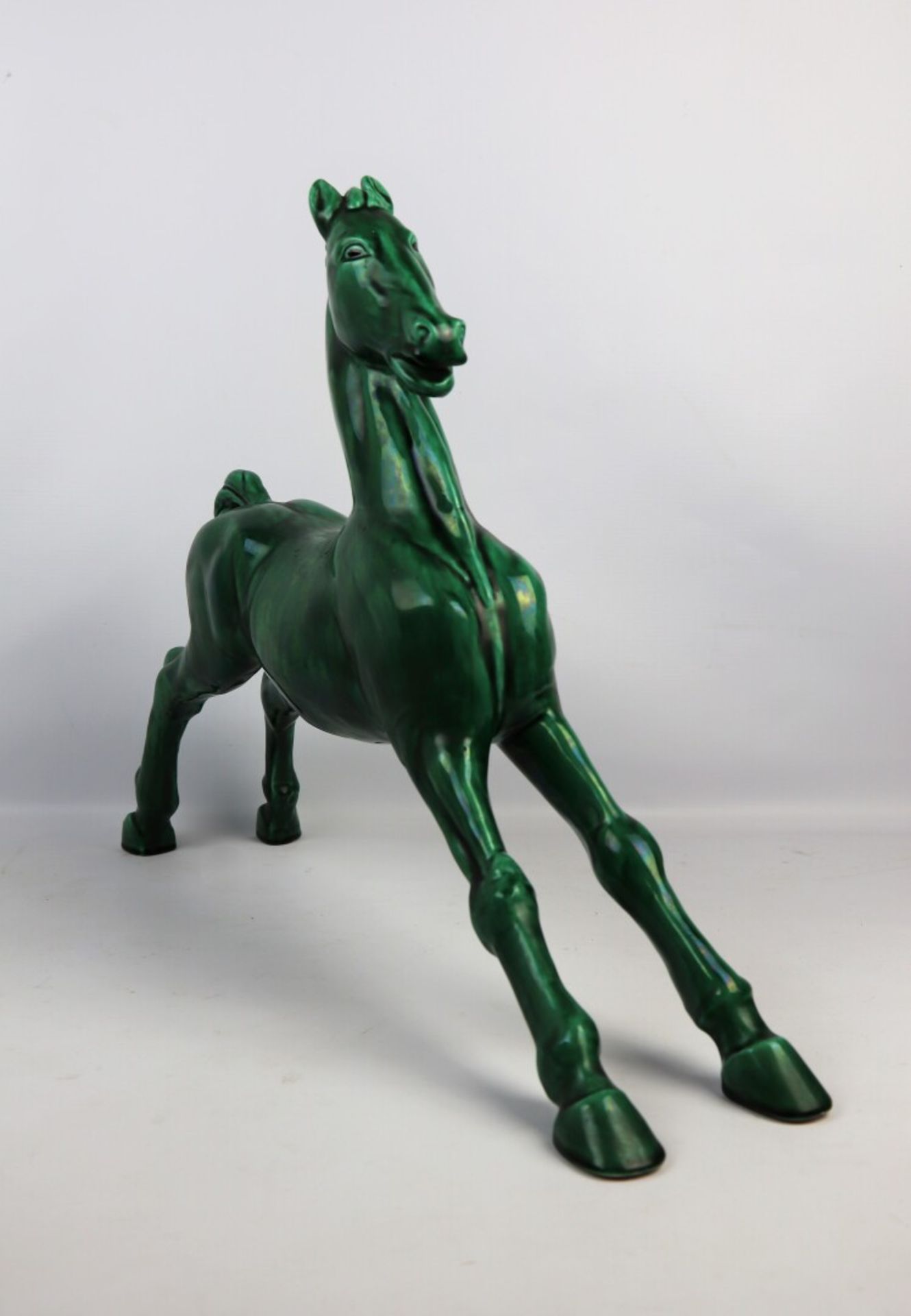 Paul MILET (1870-1950). - Cheval en céramique émaillée verte. - Signé au [...]