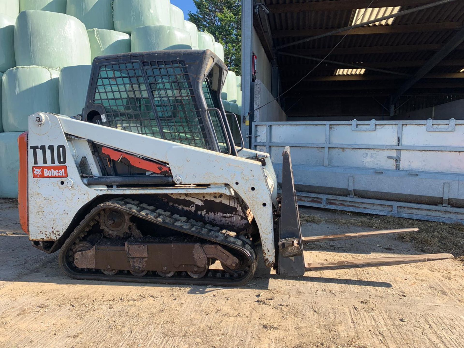 BOBCAT COMPACT TRACKED LOADER, MODEL T110, C/W FORKS, ROTAVATOR, & BUCKET *PLUS VAT*