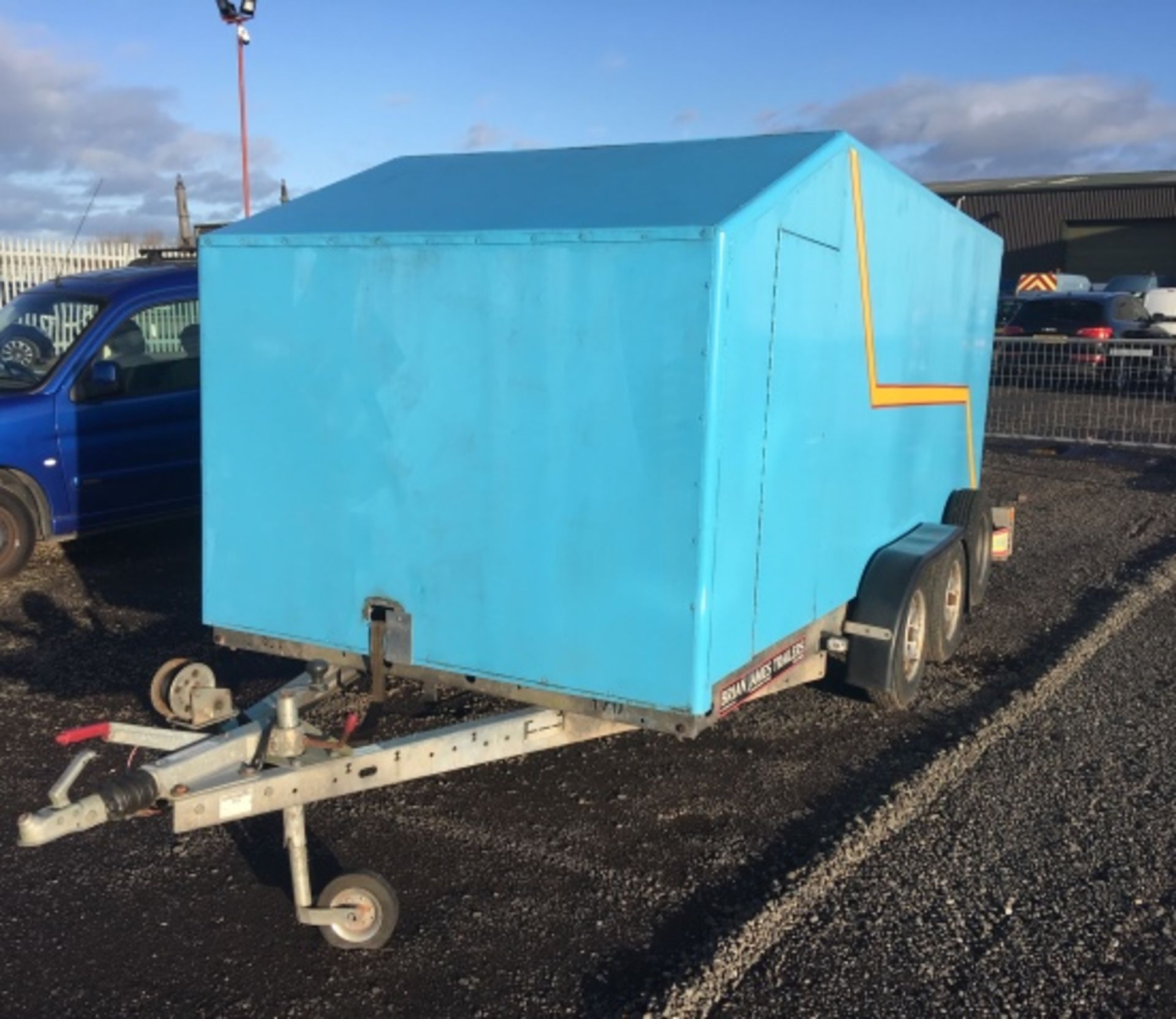 BRIAN JAMES CLUBMAN 13' x 5' box trailer. Single rear door c/w 2 side access doors. Key in office.