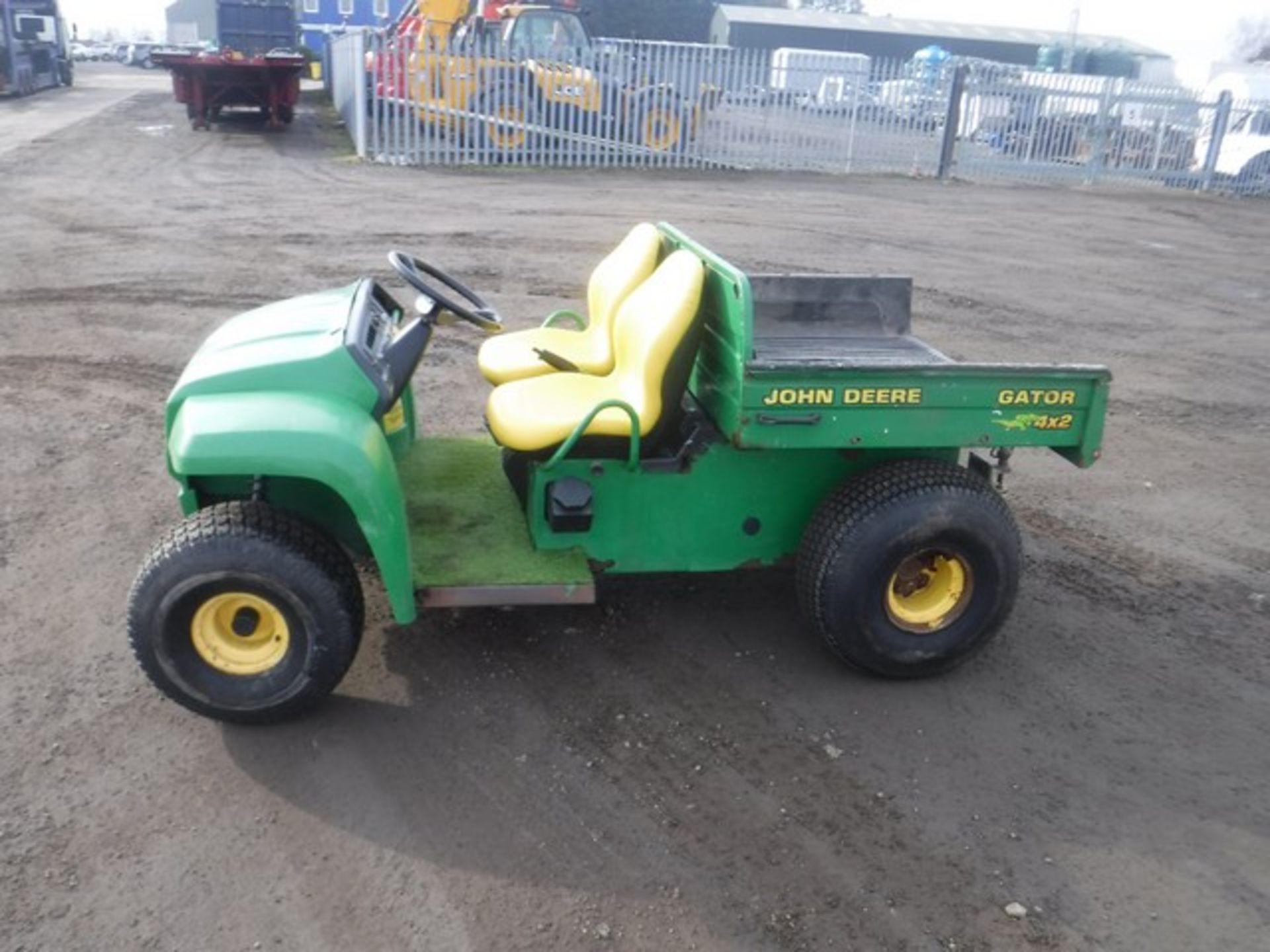 JOHN DEERE 4 x 2 petrol gator c/w bedliner, tipper kit & turf tyres.