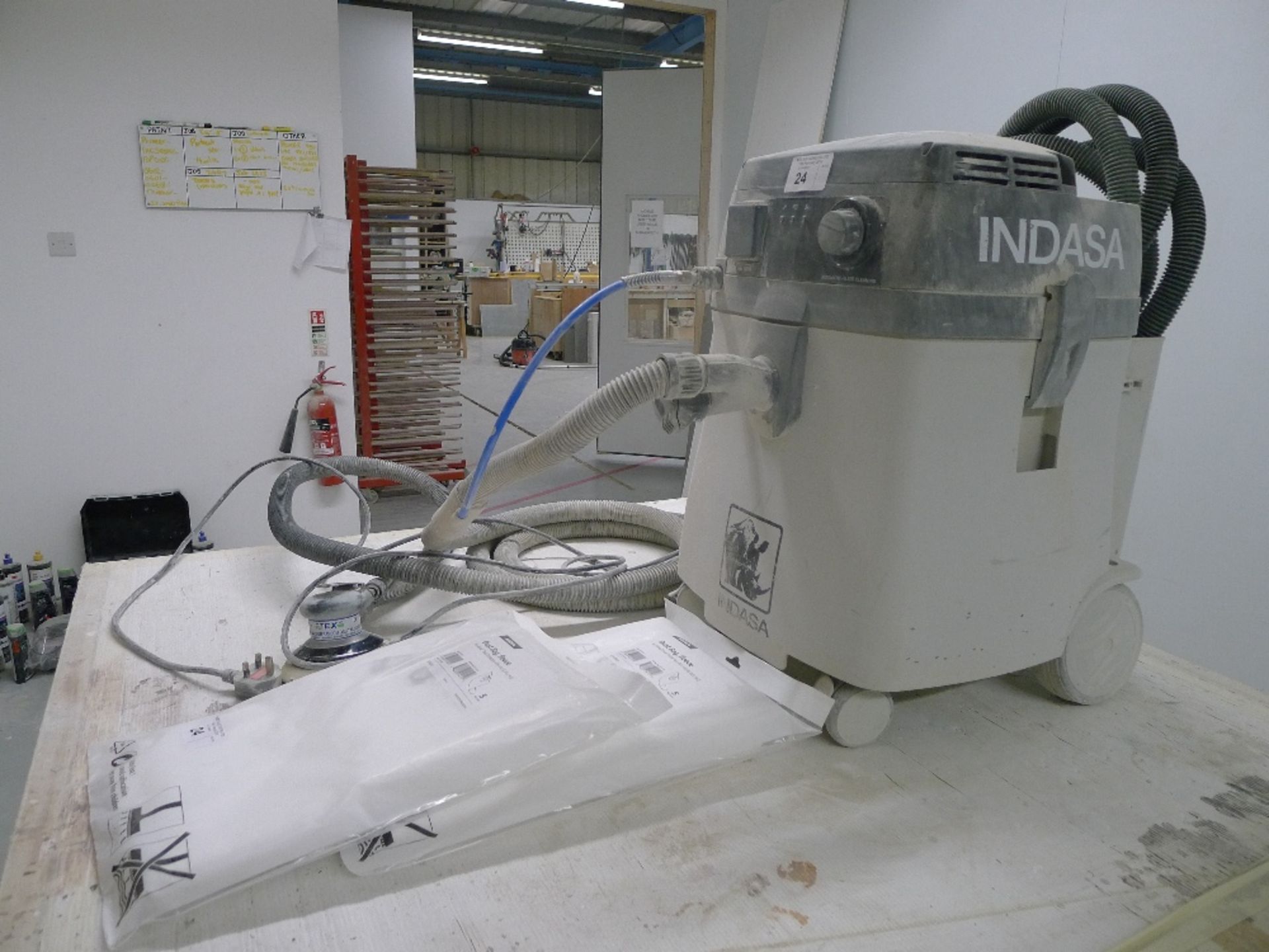 1 mobile dust extractor by Indasa with air and dust hose attached to a Tex central vacuum random