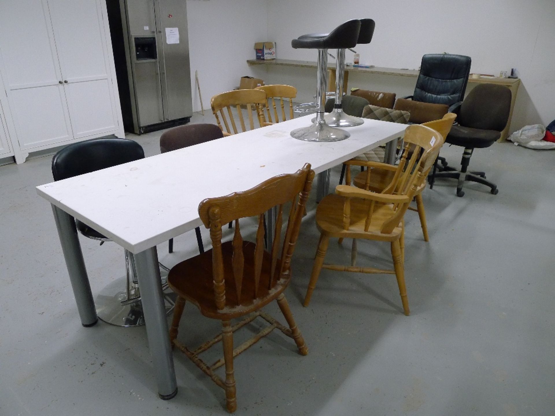 1 white rectangular table and 15 various chairs / stools – located in rest room - Image 2 of 2