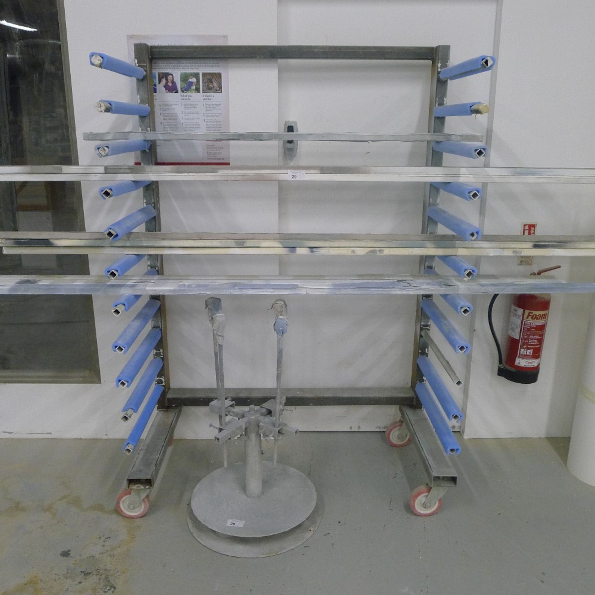 1 large paint spraying rack and 1 carousel type spraying stand