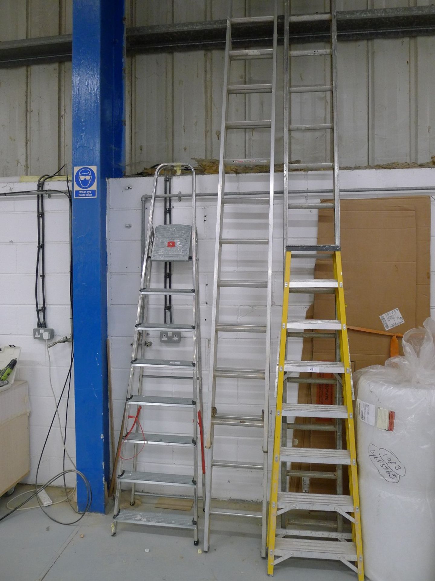 1 double extending aluminium ladder, 1 aluminium ladder, 1 fibre glass step ladder & 1 aluminium