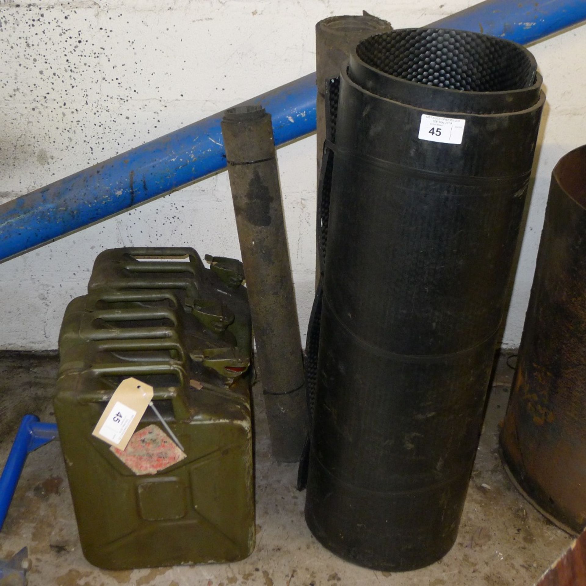 3 Jerry cans and 3 rolls of rubber matting (1 large and 2 small)