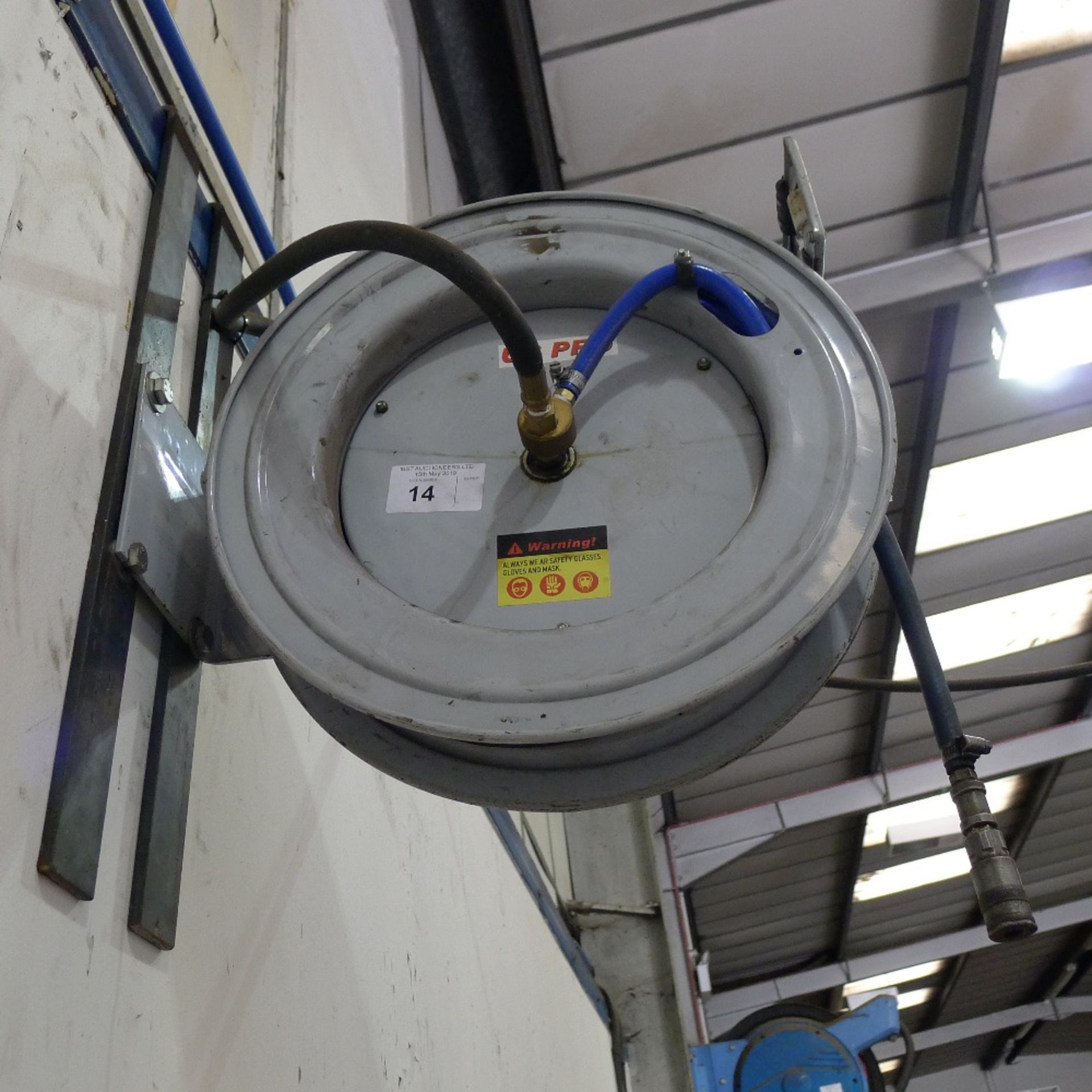 1 wall mounted retractable air hose on metal reel