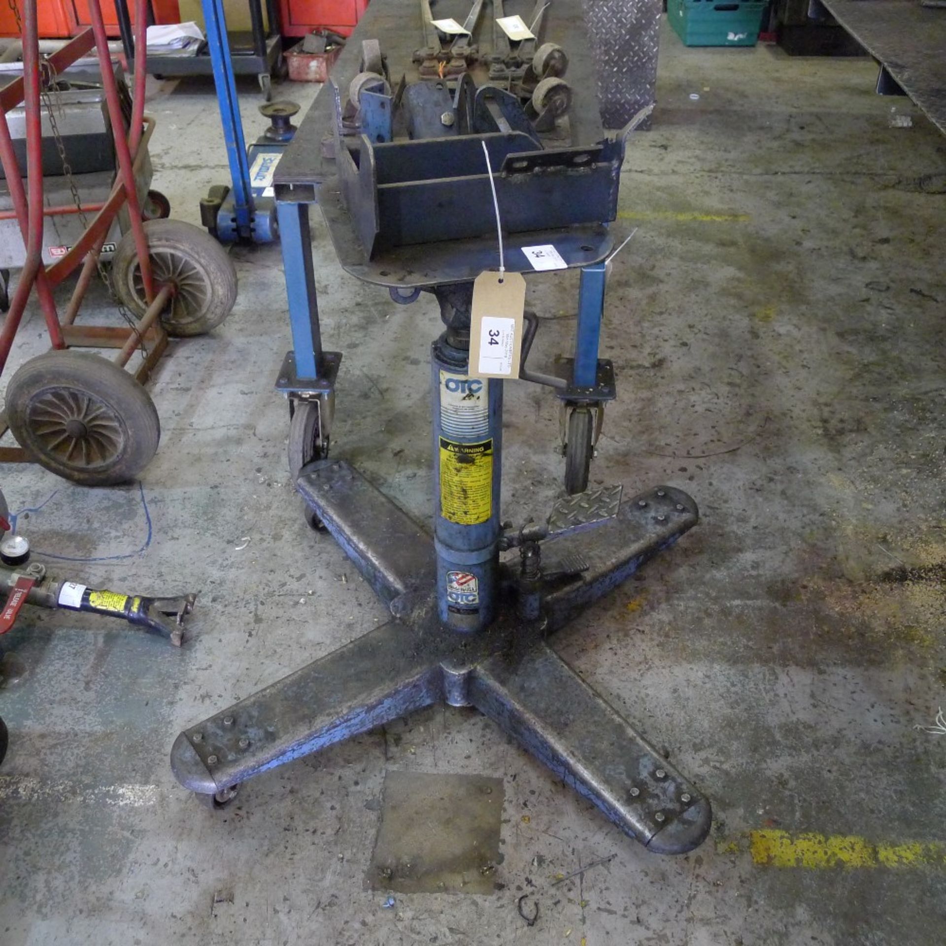 1 high lift transmission jack by OTC, capacity approx 1000lbs with Land Rover adapter plate