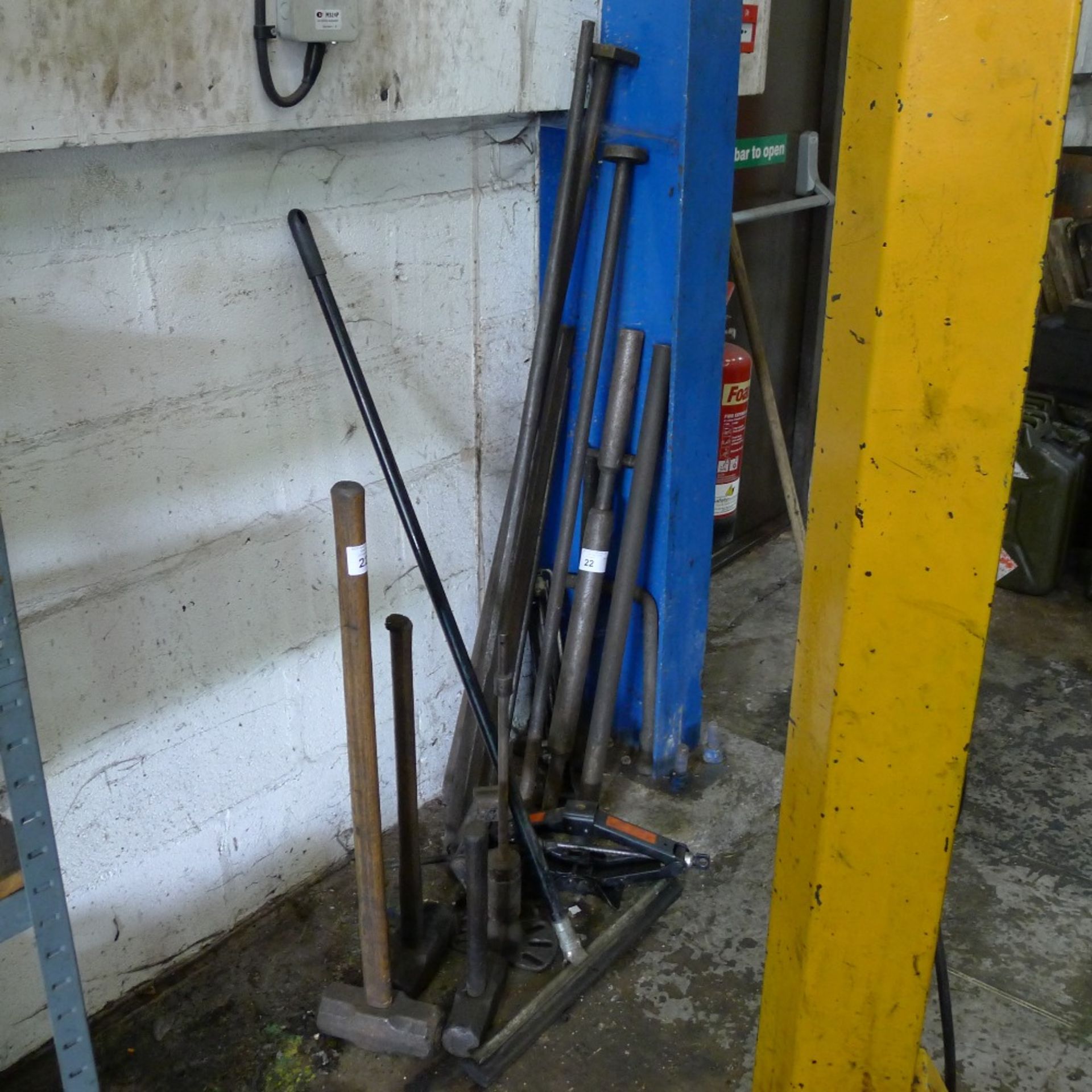 A quantity of various items including a slide hammer, 3 sledge hammers, heavy duty bars etc