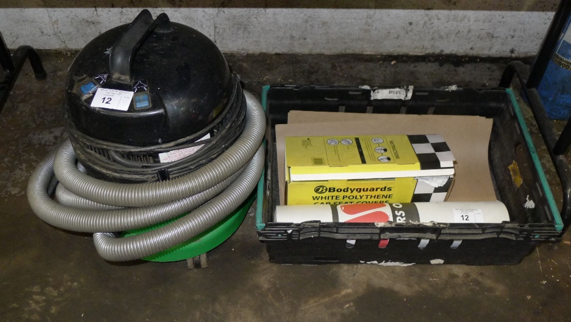 1 vacuum cleaner, 1 roll of polythene car seat covers and 1 roll of floor cover (plastic crate is