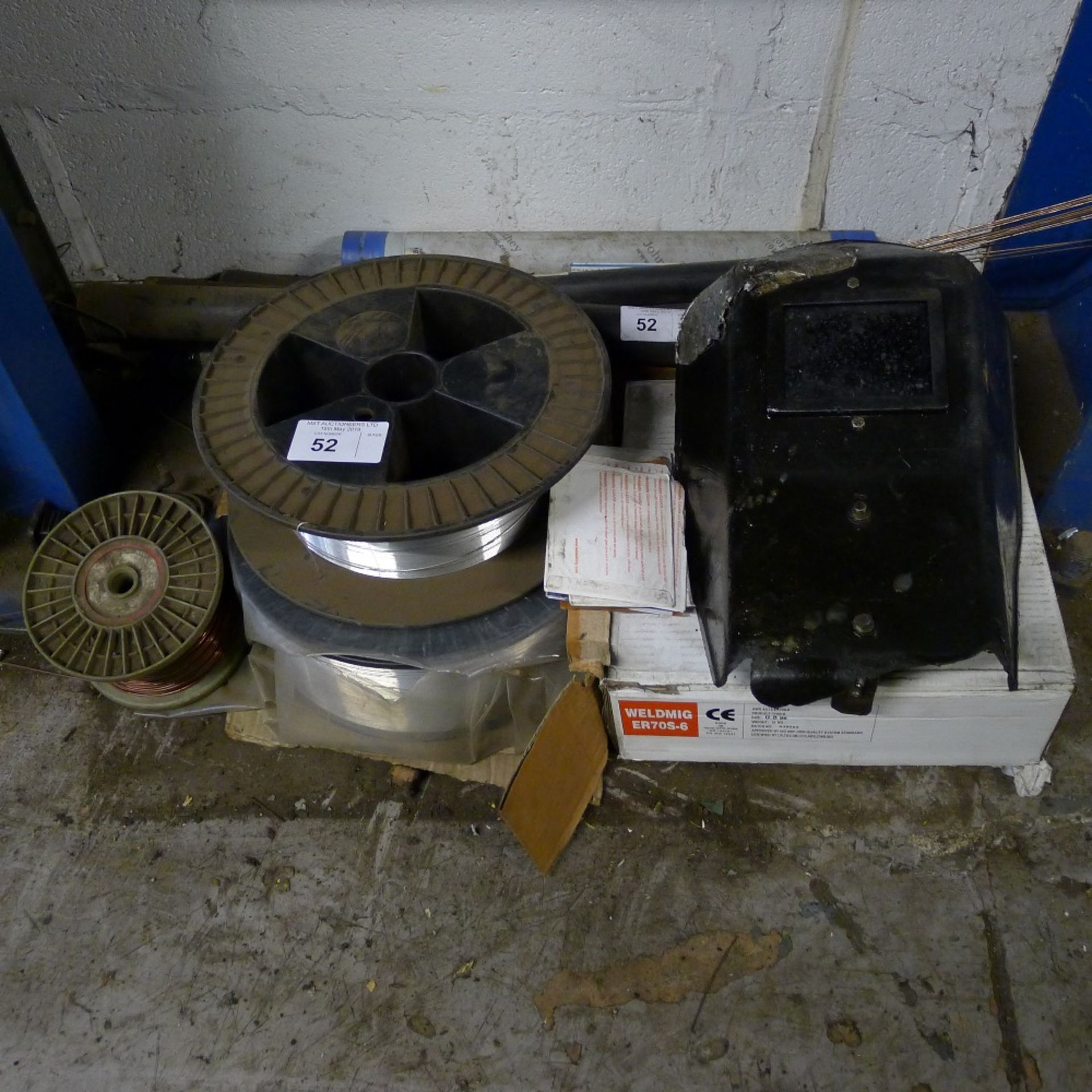 A quantity of welding related items including 3 rolls of wire, a mask etc