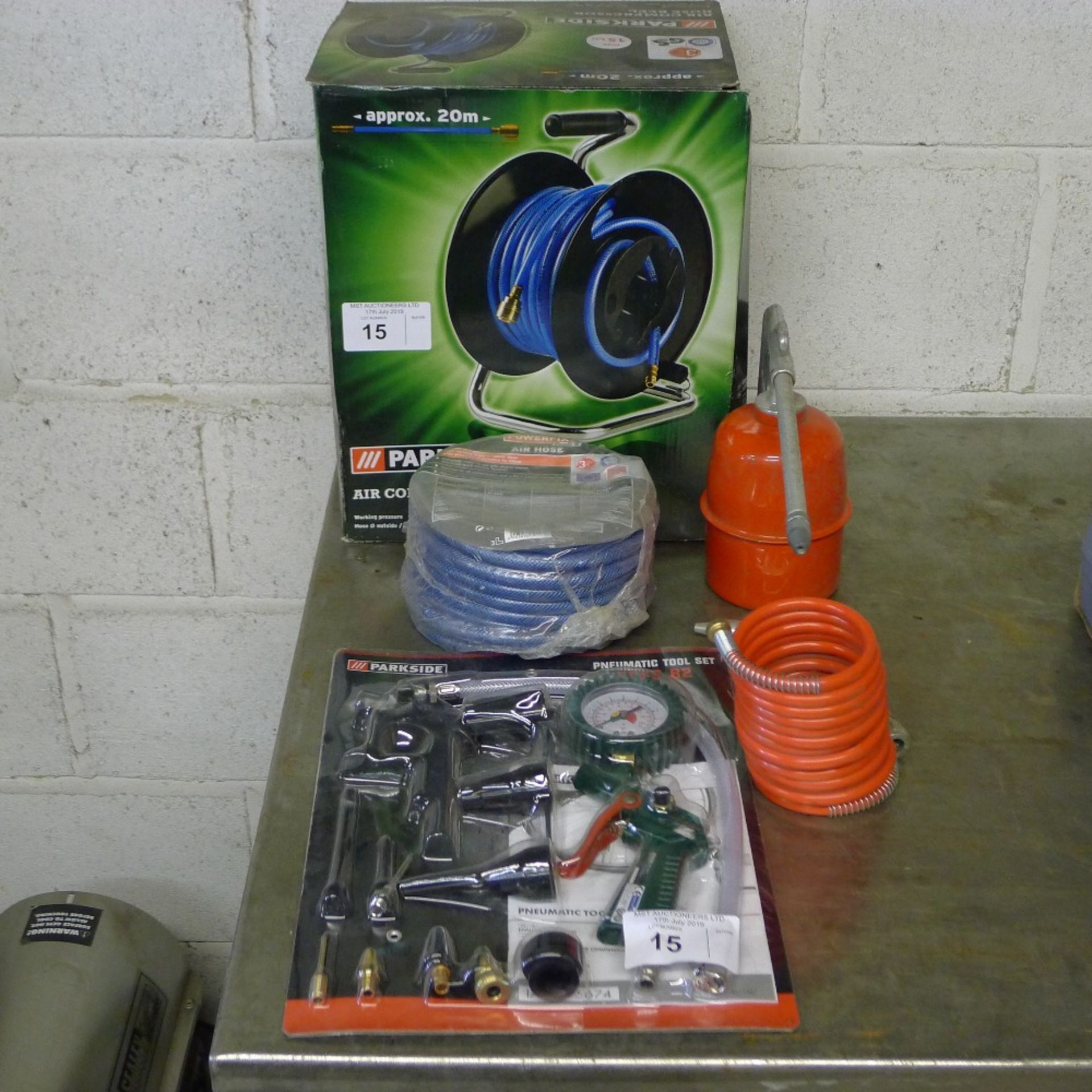 1 Parkside 20m air hose reel, 1 incomplete Parkside air tool set, 1 length of Powerfix air hose