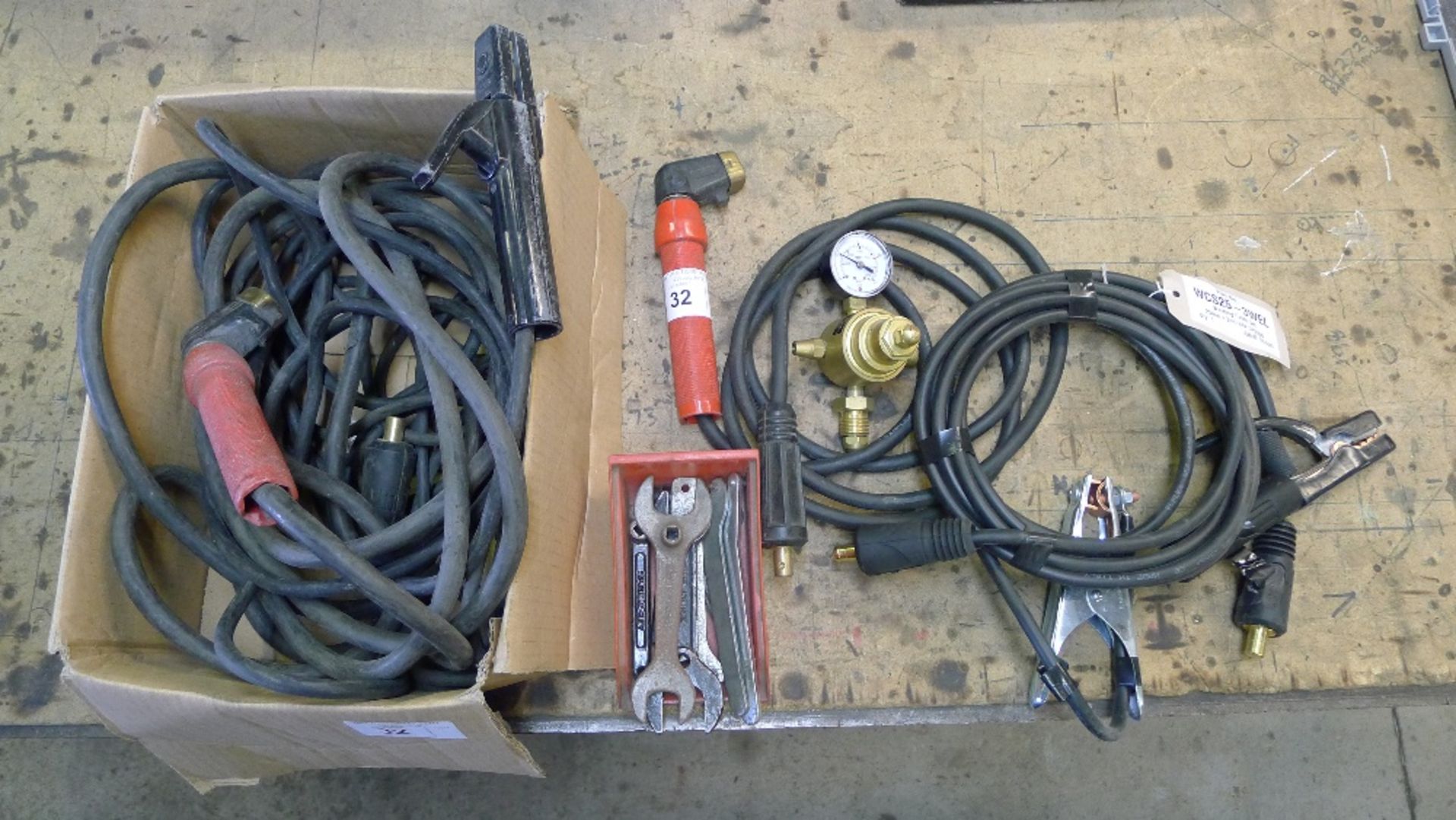 A quantity of various welding leads, holders and a gauge