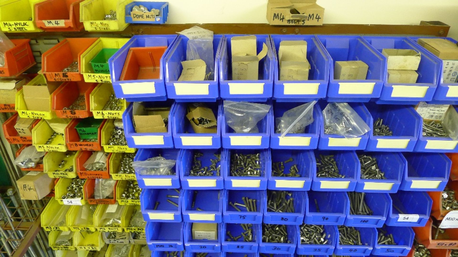 A quantity of plastic Lin type bins hanging on a free standing rack containing a large quantity of - Image 2 of 5