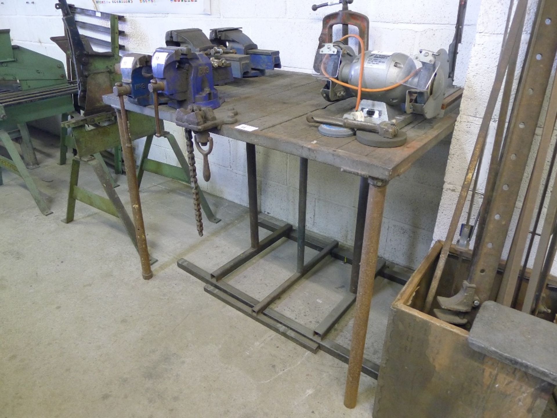 1 work table approx 1.22m x 87cm with a pipe vice and a chain vice attached together with 3 metal