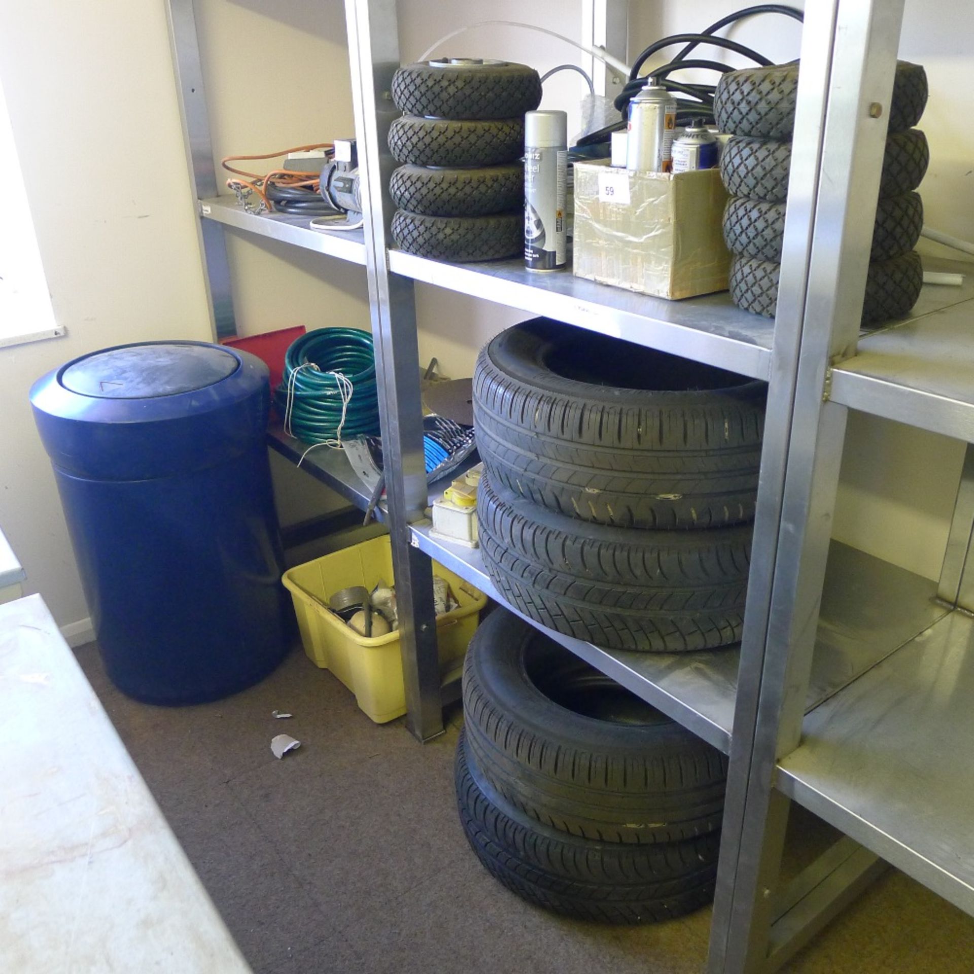 A quantity of various items including a blue bin, 4 Michelin 205/60 R15 tyres, a length of hose