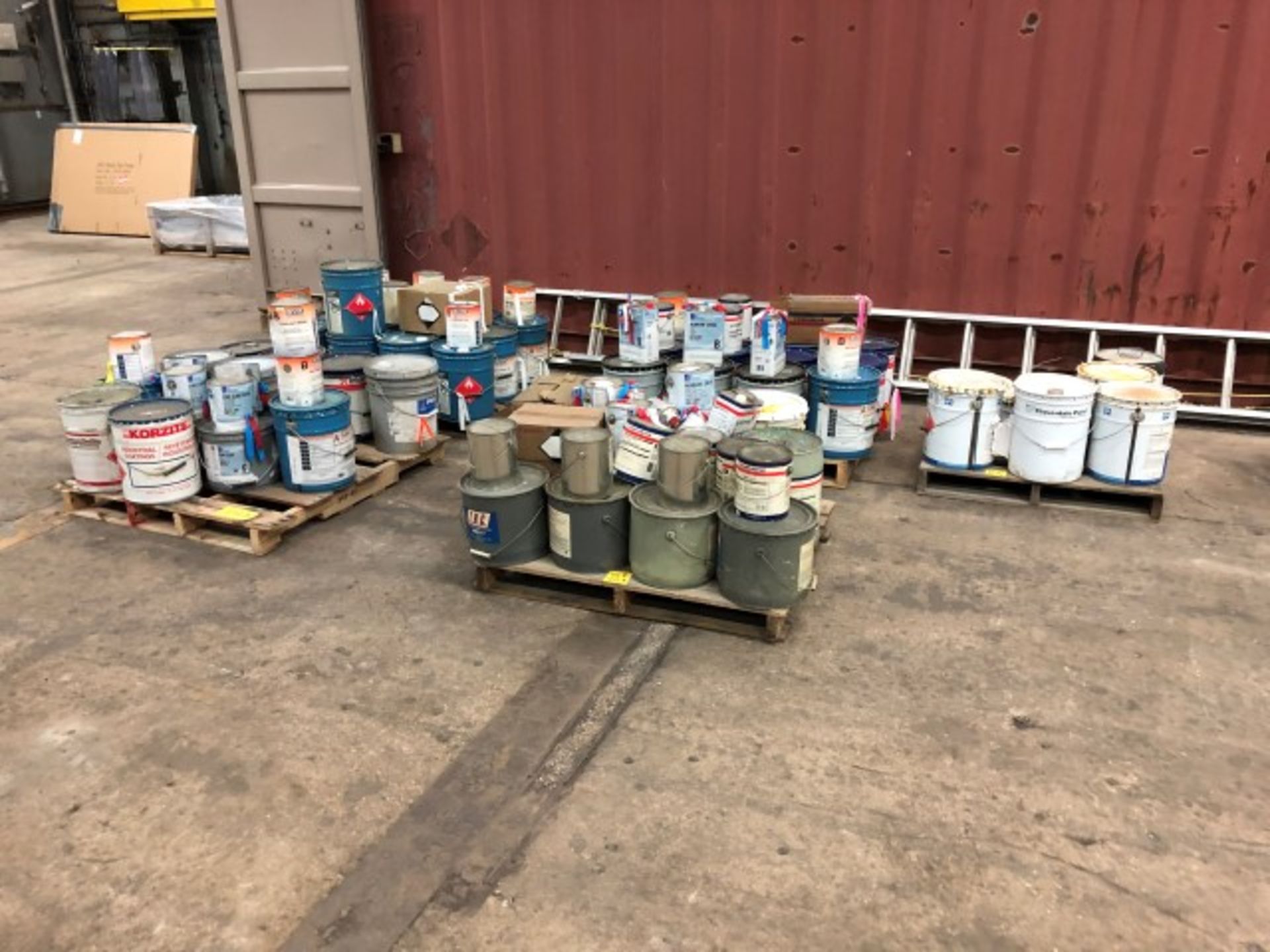 5 Pallets of assorted mostly unused paint including traffic paint, grey primer, galvanized zinc