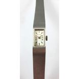 Goldene Tissot-Damenarmbanduhr. 18 ct. WG. Glattes Rectangulaire-Gehäuse. Balkengraduierung.