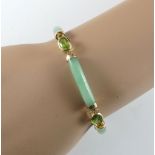 Jade-/Peridot-Armband. Fassung 14 ct. GG. L 19 cm