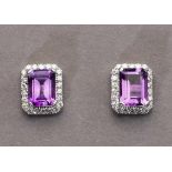 Paar Amethyst-/Brillantohrstecker. Zwei Amethyste im Smaragdschliff, ca. 2,60 ct. Mit ca. 0,46 ct.