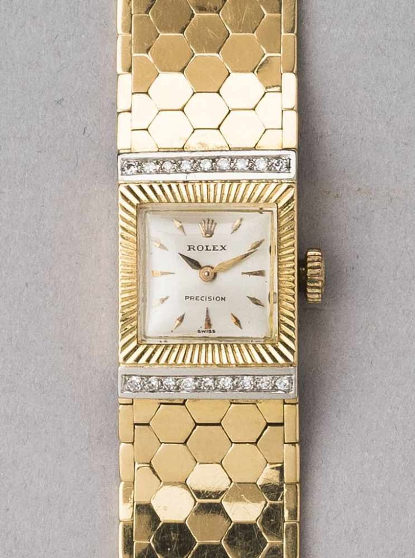 Goldene Rolex-Damenarmbanduhr, 18 ct. Modell Cellini. Massives Karreegehäuse. Lunette strahlenförmig