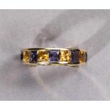 Farbstein-Memoryring. Neun Citrine im Princess-Schliff, ca. 3,02 ct. Neun Iolithe im Princess-