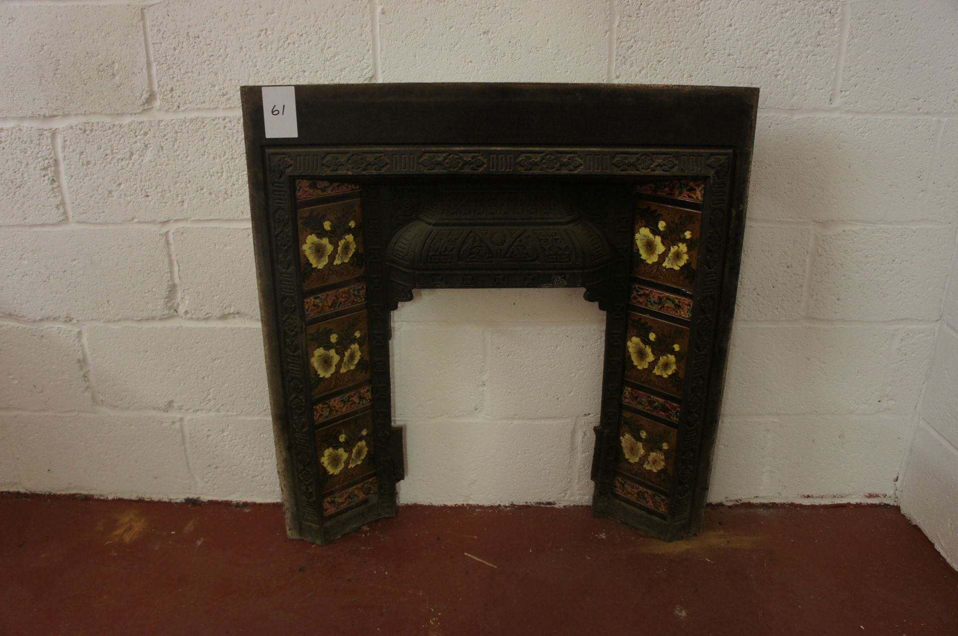 Cast iron fireplace insert with tile inserts