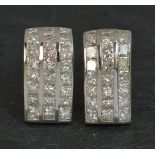 A stunning pair of Diamond and 18ct Gold earrings