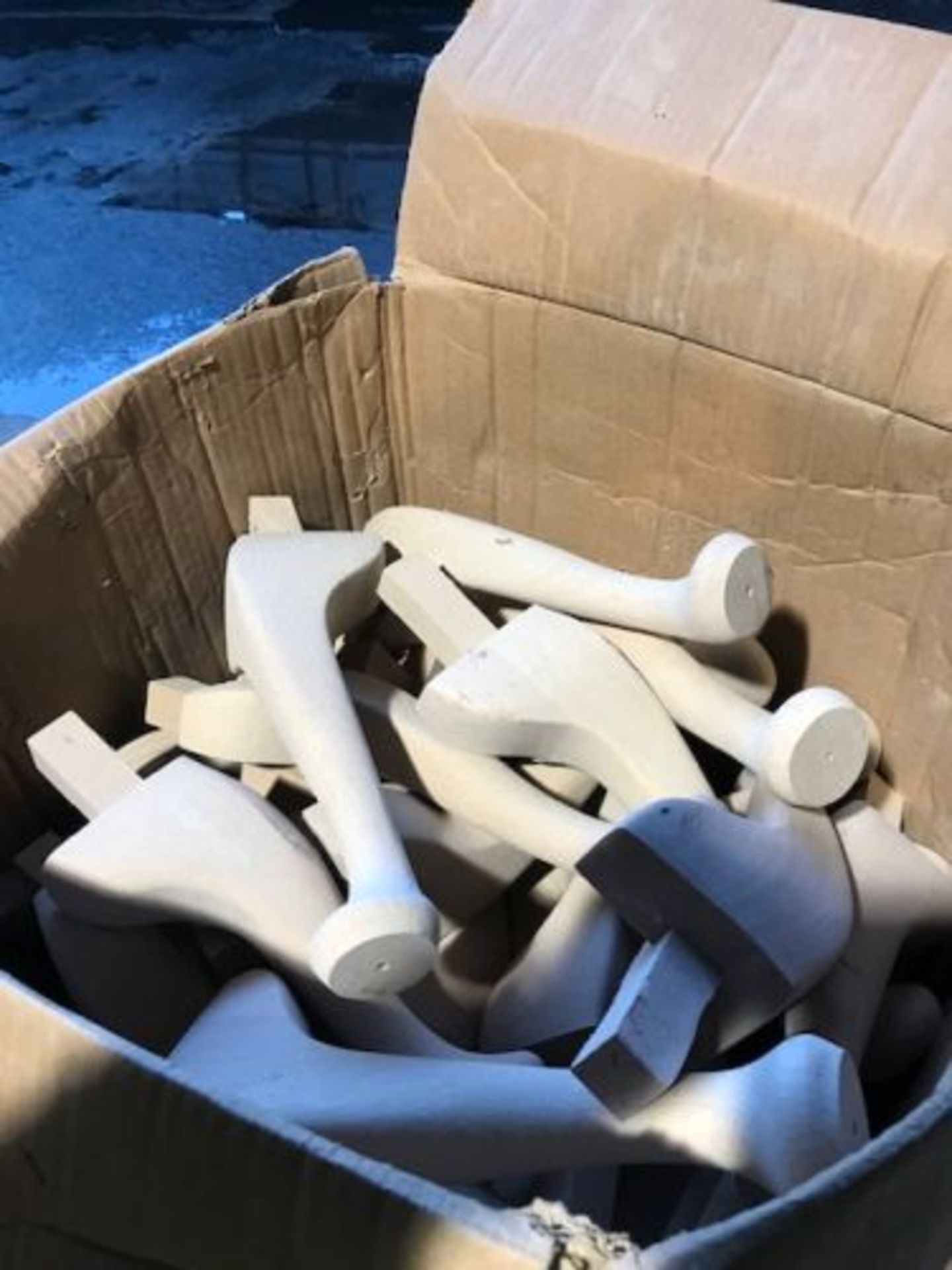 Box of large chair legs unstained