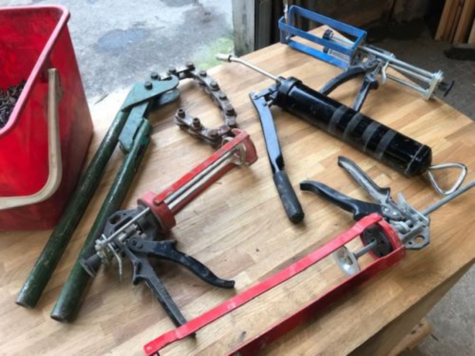 Tub of Clout nails/pipe cutter/grease guns & 3 mastic guns - Image 4 of 4