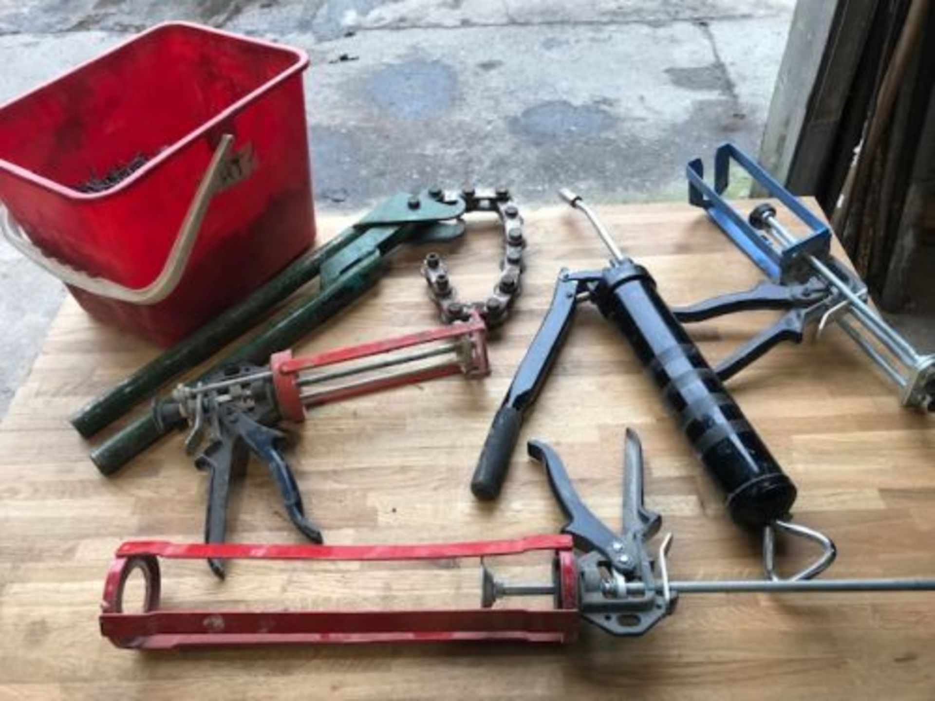 Tub of Clout nails/pipe cutter/grease guns & 3 mastic guns